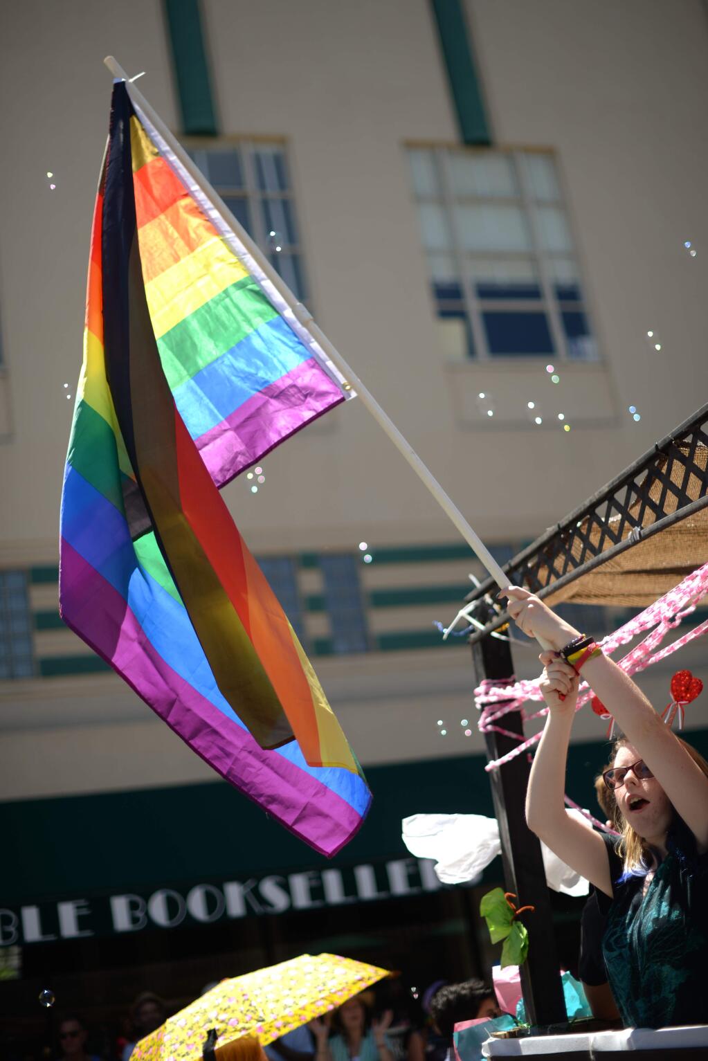 Annanay Chabot, 14, rides on the North Bay LGBTQI Families float during the 31st annual Sonoma County Pride Festival held for the first time in downtown Santa Rosa, California on Saturday, June 2, 2018. (ERIK CASTRO/ FOR THE PD)