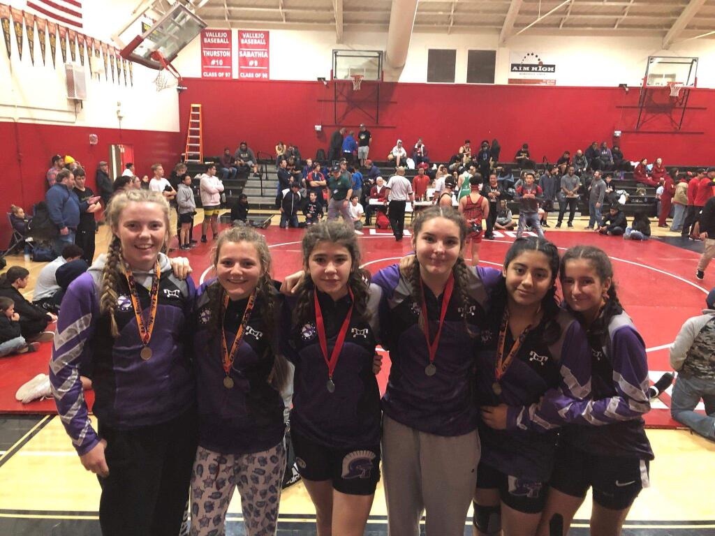 MIKE BUTTS PHOTOThe Petaluma High School girls wrestling team found success with eight medals, including four for first place in the Vallejo Girls Tournament.