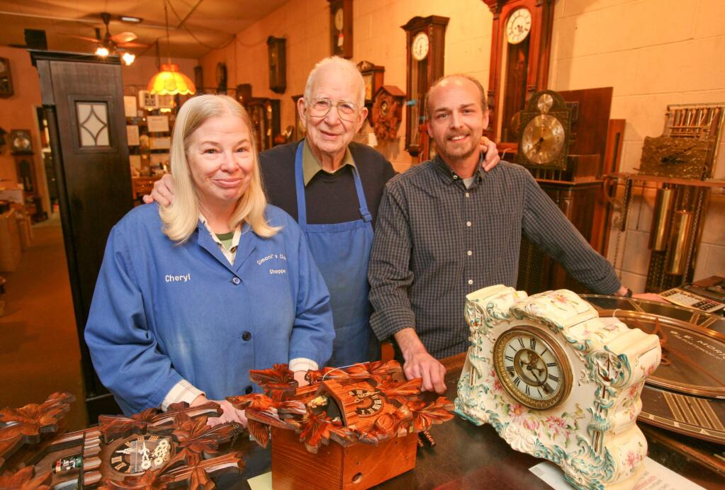 Hank Simoni, center, with is daughter Cheryl Shields and his grandson Sean Shields in Simoni's Clocks in Downtown Petaluma on Tuesday, January 20, 2015. (SCOTT MANCHESTER/ARGUS-COURIER STAFF)