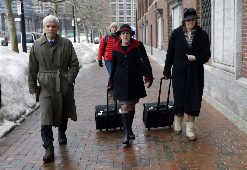 Members of the legal defense team for Boston Marathon bombing suspect Dzhokhar Tsarnaev, including David Bruck, left, Miriam Conrad, center, and Judy Clarke, right, arrive at federal court, Wednesday, March 4, 2015, in Boston, on the first day of Tsarnaev's federal death penalty trial. Tsarnaev is charged with conspiring with his brother to place two bombs near the marathon finish line in April 2013, killing three and injuring 260 people. (AP Photo/Michael Dwyer)