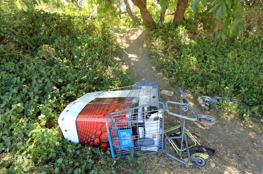 A shopping cart at the entrance to Orr Creek in Ukiah, Thursday July 31, 2014. (Kent Porter / Press Democrat) 2014