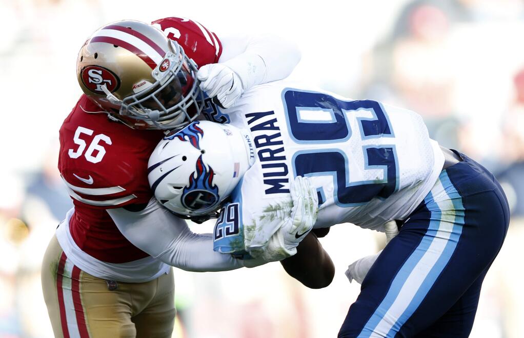 San Francisco 49ers outside linebacker Reuben Foster, left, tackles Tennessee Titans running back DeMarco Murray during the first half on Sunday, Dec. 17, 2017, in Santa Clara. (AP Photo/John Hefti)