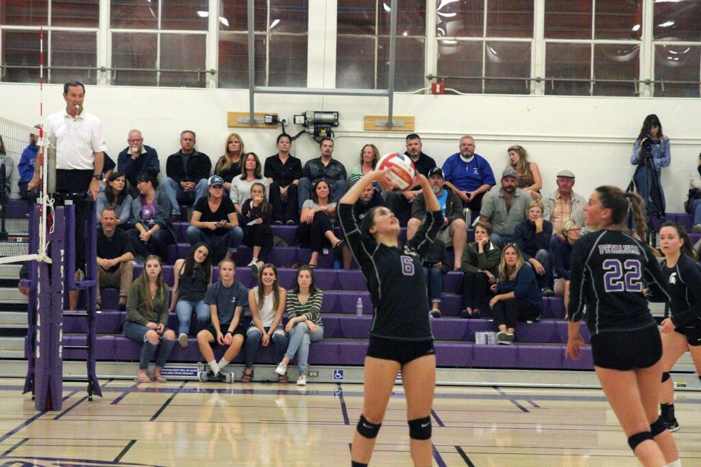 SUMNER FOWLER/FOR THE ARGUS-COURIERPetaluma's Serena Horvath (6) sets for teammate Grace Ghirardelli in T-Girls win over Analy. Tuesday night, Analy reversed the result to gain a tie with Petaluma atop the Sonoma County League standings.