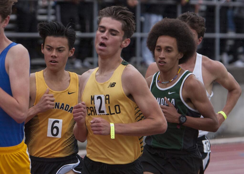 Rory Smail of Maria Carillo, center and Andre Williams of Sonoma Academy, right, run in heavy traffic of the 3200 meter race on Saturday, May 18 at Diablo Valley College in Pleasant Hill, California. (Frankie Frost/Special to the (Press Democrat)