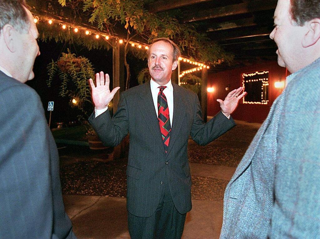 Congressman Frank Riggs greets Randy Rogers and Pete Pellini at the entrance of Villa Chanticleer in Healdsburg where Riggs' retirement party was held. (Christopher Chung / The Press Democrat, 1999)