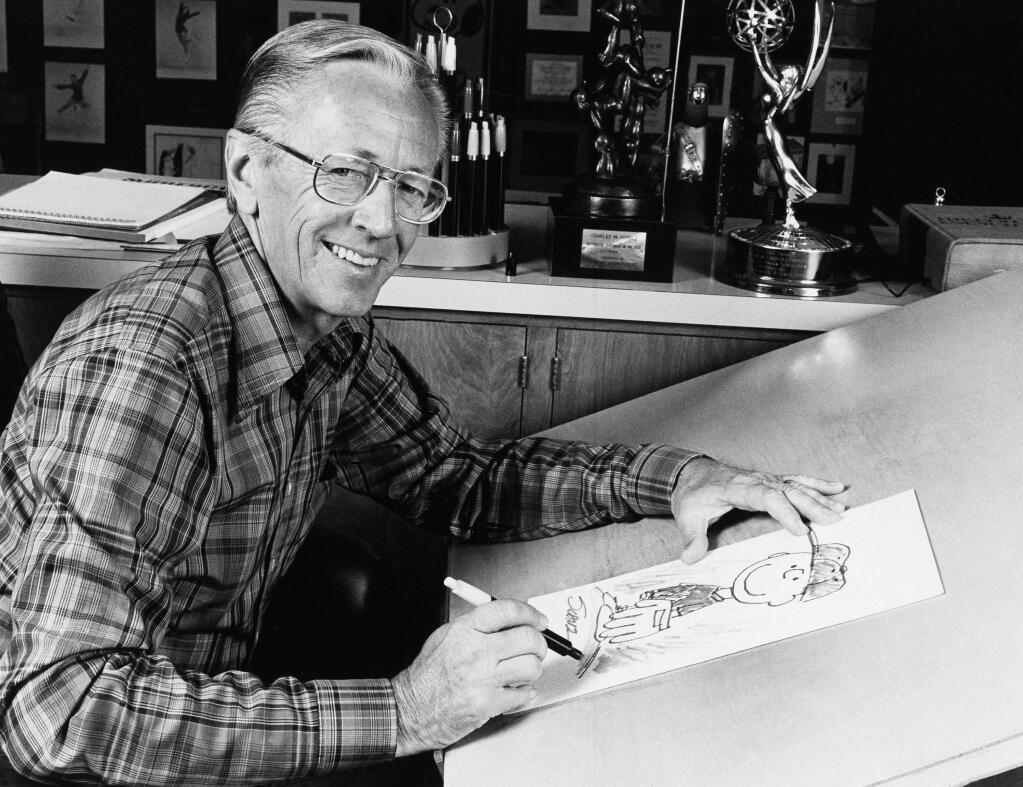 The new 'Peanuts' movie, premieres Friday, Nov. 6. Take a moment to explore classic photos from the PD archive, showing hometown hero Charles Schulz and his beloved 'Peanuts' gang. Cartoonist, Charles M. Schulz, 1978. (AP Photo)