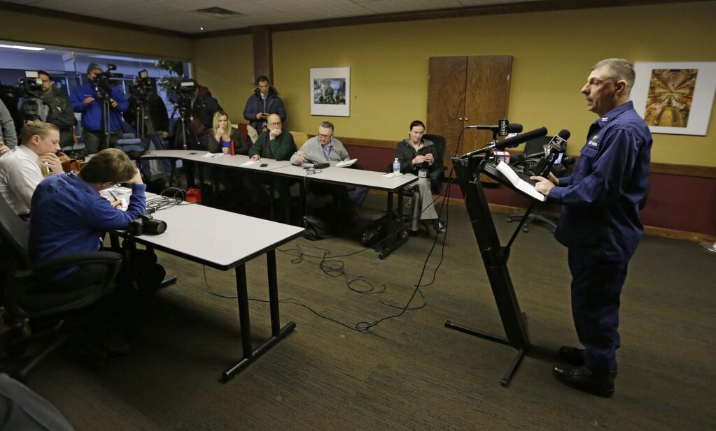 Capt. Michael Mullen of the U.S. Coast Guard answers questions during a news conference at Burke Lakefront Airport, Friday, Dec. 30, 2016, in Cleveland. The U.S. Coast Guard says there's been no sign of debris or those aboard a plane that took off from the airport on the shores of Lake Erie and went missing overnight. (AP Photo/Tony Dejak)