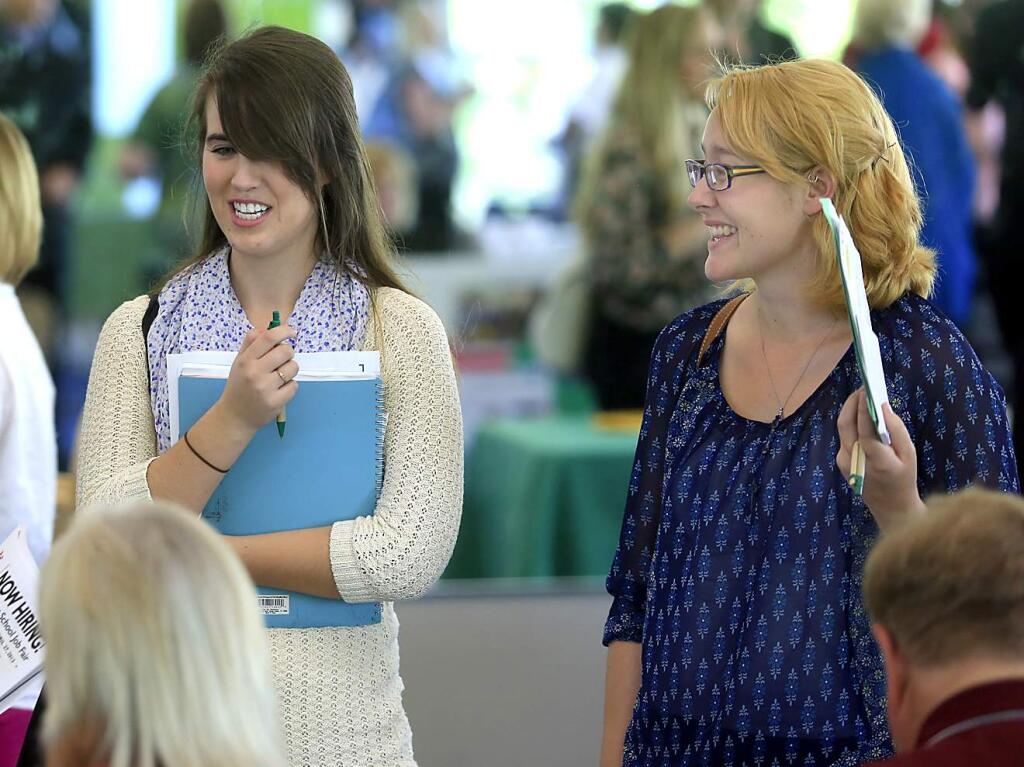 Stephanie Field and Kaherine Vuylsteke attend a job fair at Sonoma State University in Rohnert Park in 2013. (KENT PORTER/ PD FILE)