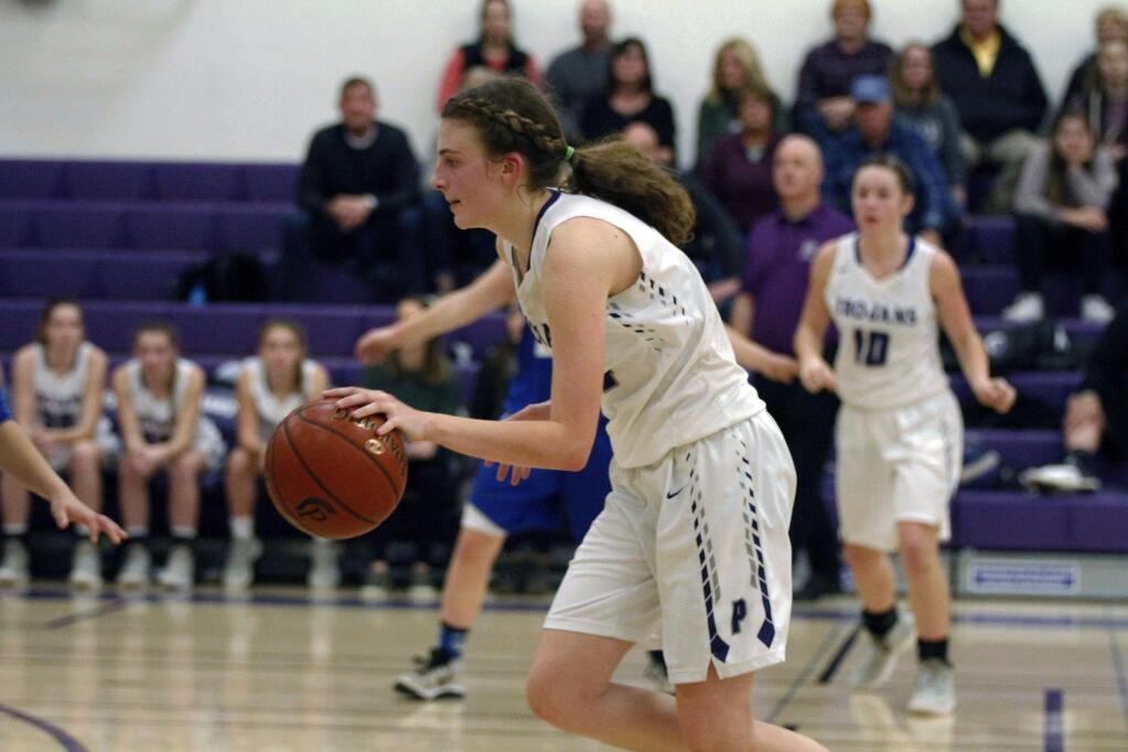 DWIGHT SUGIOKA/FOR THE ARGUS-COURIERKelsey Martin brings the ball up court for Petaluma. She scored 23 points in a 60-52 win over Analy.