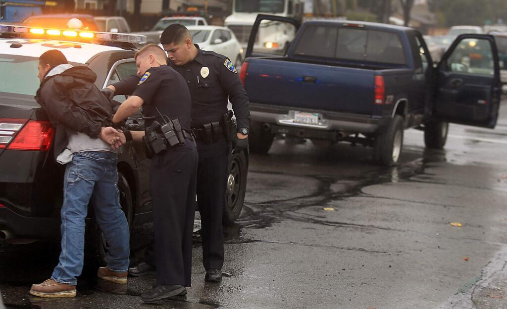 Daniel Lee Ward, 32, is arrested by Healdsburg police officers at College Ave. and Fulton Road, Thursday Dec. 8, 2016 after Ward led them on a high speed chase. (Kent Porter / The Press Democrat) 2016