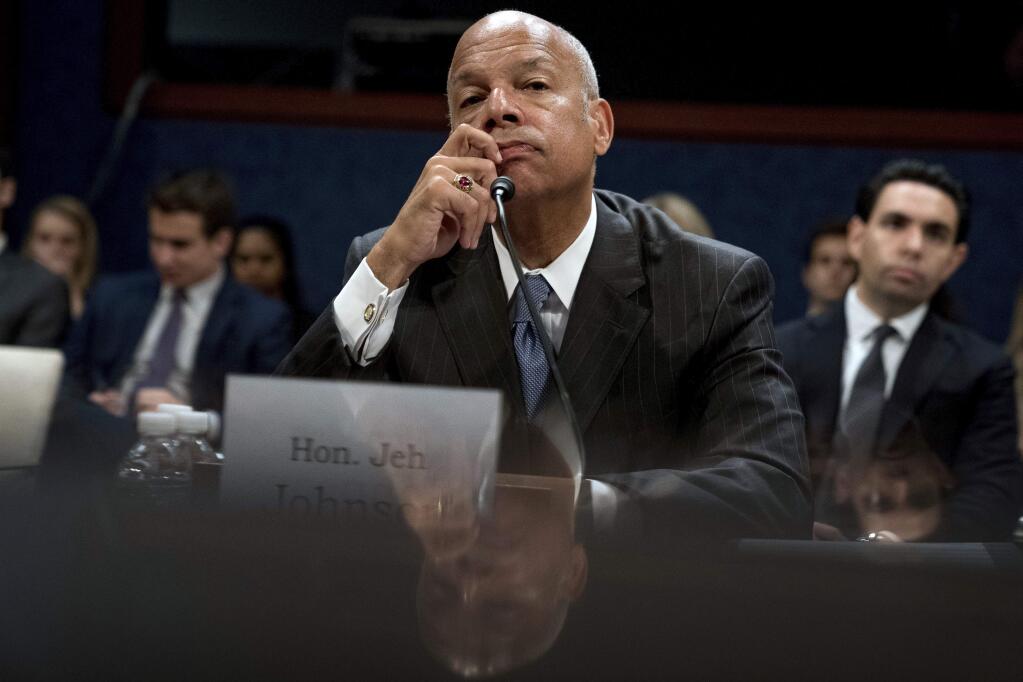 Former Homeland Security Secretary Jeh Johnson testififying Wednesday before the House Intelligence Committee. (ANDREW HARNIK / Associated Press)