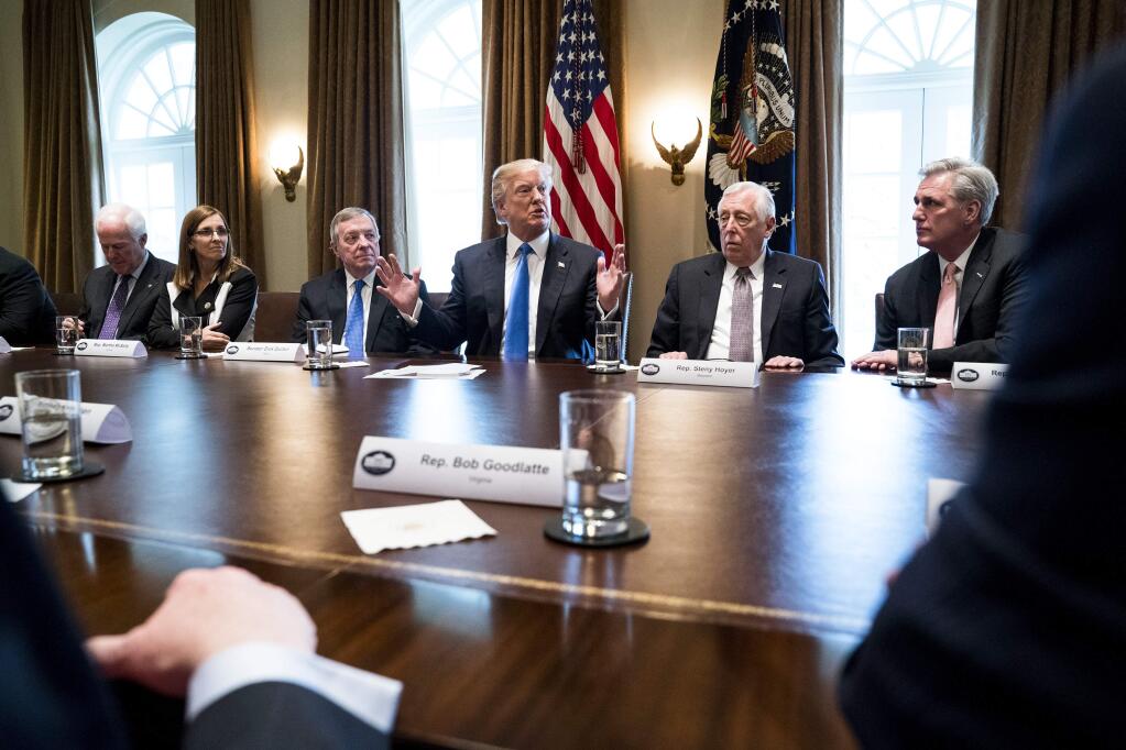 President Donald Trump with lawmakers during a bipartisan meeting on immigration Tuesday at the White House. (DOUG MILLS / New York Times)