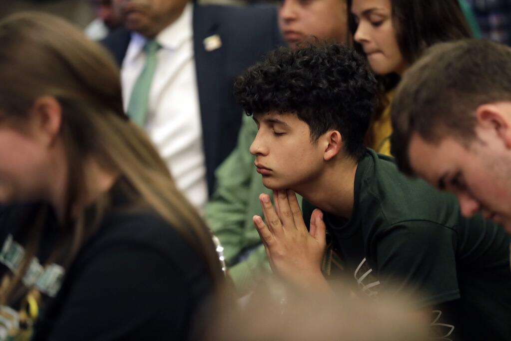 Santa Fe students takes part in a roundtable discussion in Austin, Texas, Thursday, May 24, 2018, hosted by Texas Gov. Gregg Abbott to address safety and security at Texas schools in the wake of the shooting at Santa Fe, Texas. Thursday's roundtable included victims, students, families and educators from the Santa Fe, Alpine and Sutherland Springs communities. (AP Photo/Eric Gay)