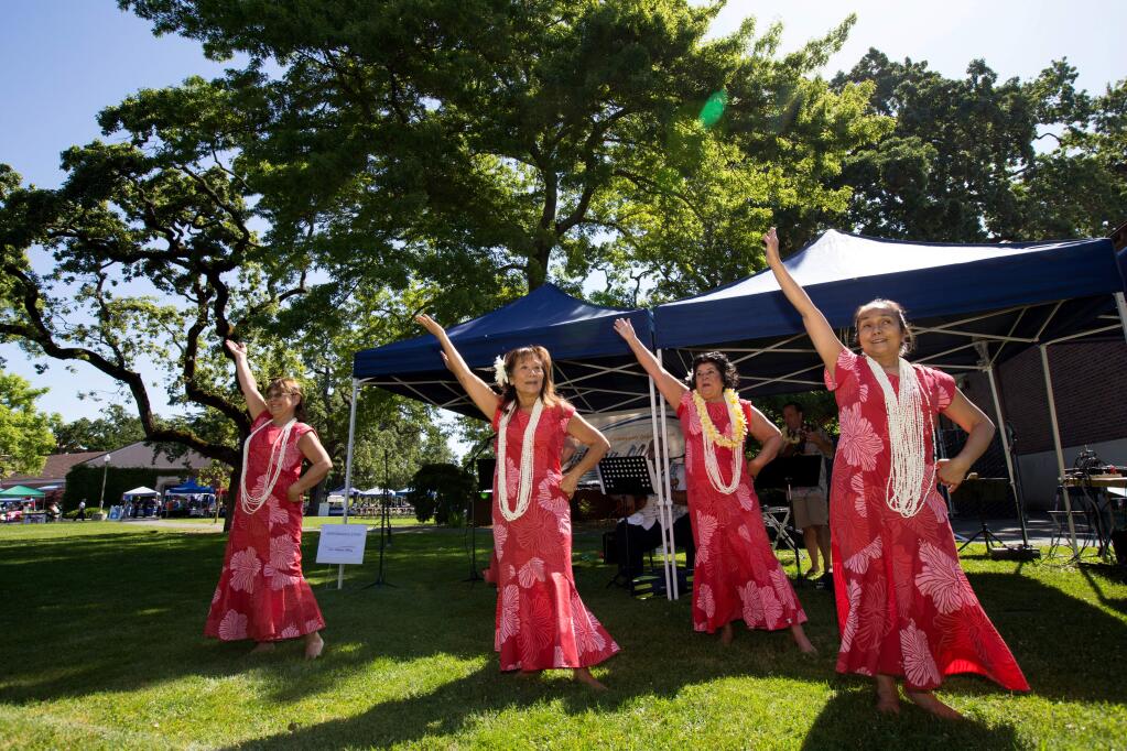 Dancers of Sonoma dance hula at the fourth Annual May Day Aloha Festival, held during the annual Day Under the Oaks at Santa Rosa Junior College, in Santa Rosa, Sunday, May 7, 2017. (Photo by Darryl Bush / For The Press Democrat)