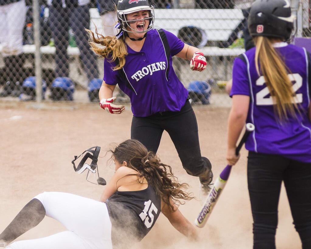 RICH LANGDON/FOR THE ARGUS-COURIERPetaluma's Kailee Silacci celebrates after scoring the winning run in her team's 8-7 win over Analy in the SCL Tournament championship game.