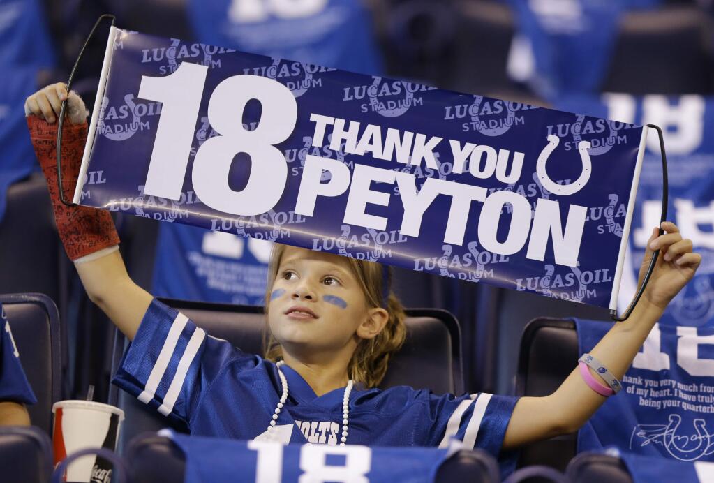 A fan holds up a sign before an NFL football game between the Indianapolis Colts and the San Francisco 49ers, Sunday, Oct. 8, 2017, in Indianapolis. (AP Photo/Michael Conroy)