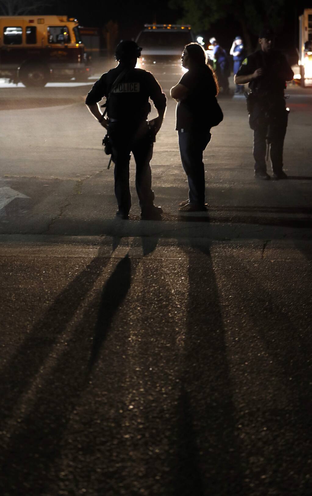 A police officer speaks to a man who was at the Gilroy Garlic Festival following a deadly shooting at the festival at Gilroy High School in Gilroy, Calif., on Sunday, July 28, 2019. (Nhat V. Meyer/Bay Area News Group)