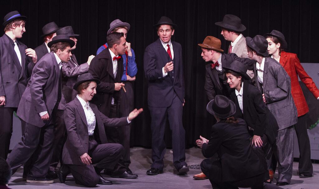 Sky Masterson (played by Max Szanyi) sings 'Luck be a Lady' as crapshooters play their game in Sonoma Valley High School's production of Guys & Dolls. (Photos by Robbi Pengelly/Index-Tribune)