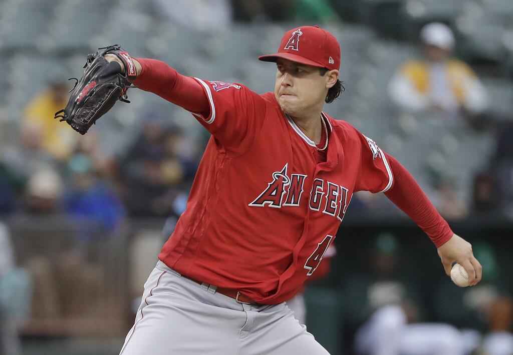 Los Angeles Angels pitcher Tyler Skaggs throws against the Oakland Athletics during the first inning of a baseball game in Oakland, Calif., Friday, June 15, 2018. (AP Photo/Jeff Chiu)