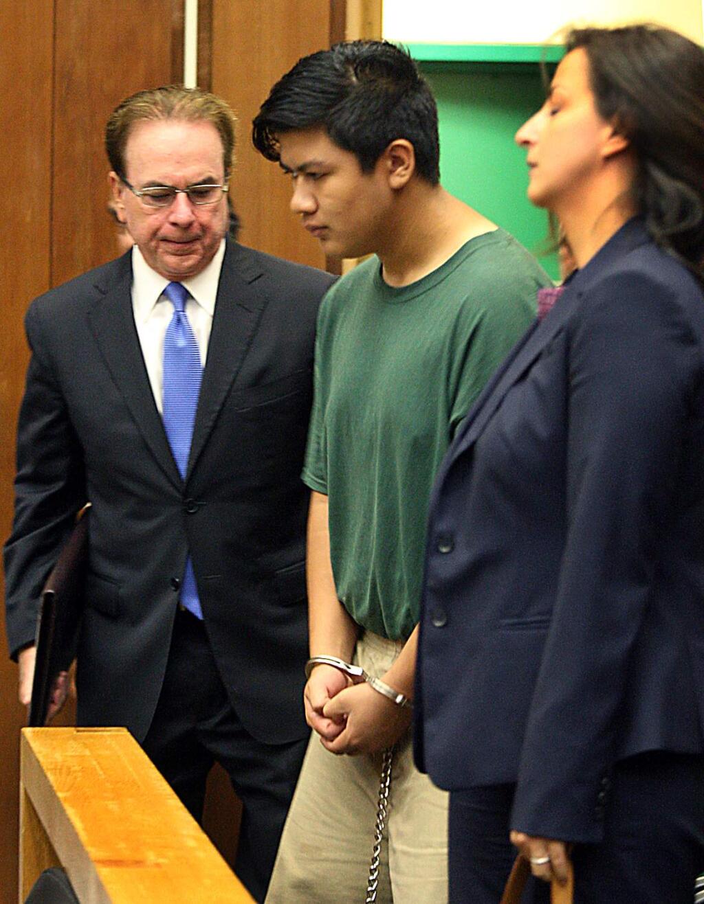 Adrian Jerry Gonzalez, center, is flanked by public defender Larry Biggam and attorney Leila Sayar as they enter the courtroom Thursday, July 30, 2015 where his arraignment was delayed in Santa Cruz, Calif. Gonzalez charged with murder, kidnapping and rape in the death of 8-year-old Madyson Middleton, in an artists' complex in the California beach town. (Dan Coyro/Santa Cruz Sentinel via AP) MANDATORY CREDIT