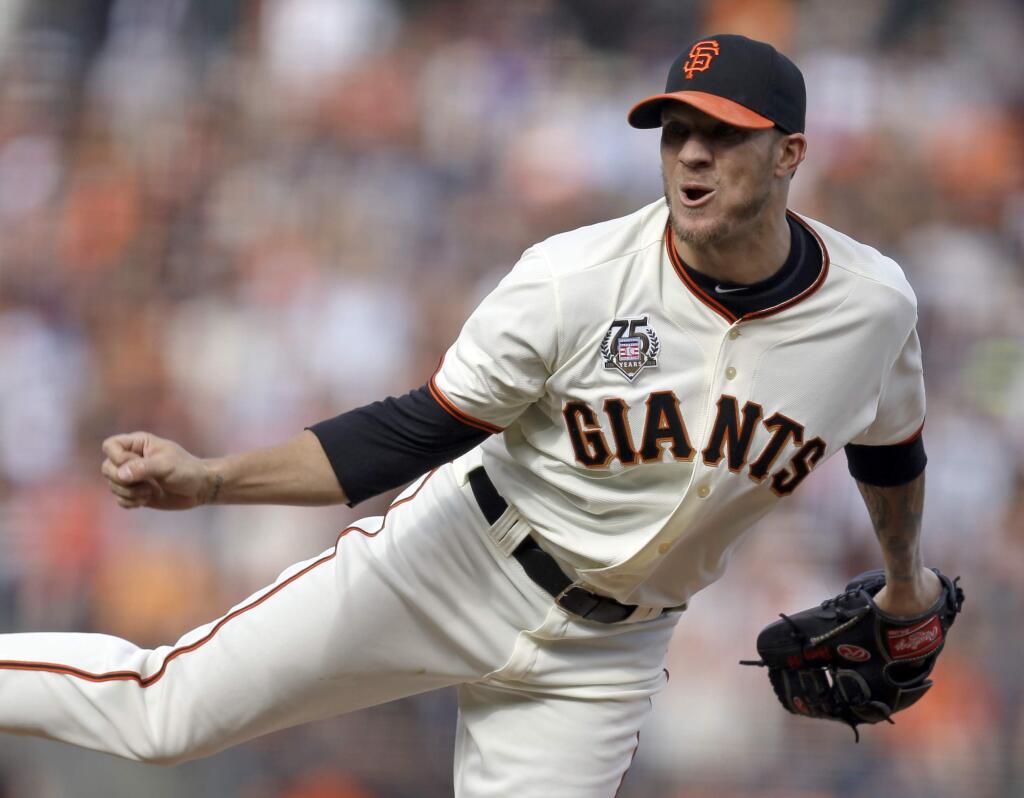 San Francisco Giants' Jake Peavy works against the Los Angeles Dodgers in the first inning of a baseball game Sunday, July 27, 2014, in San Francisco. (AP Photo)