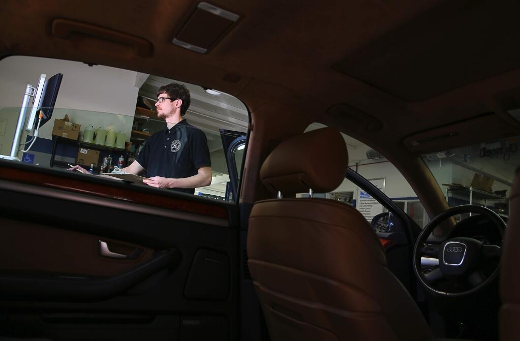 Service Consultant Marc Brady runs a diagnostics test on a vehicle at Hammond Autowerks in Santa Rosa on Thursday, March 2, 2017. Brady is a graduate of the SRJC automotive training program.(Christopher Chung/ The Press Democrat)