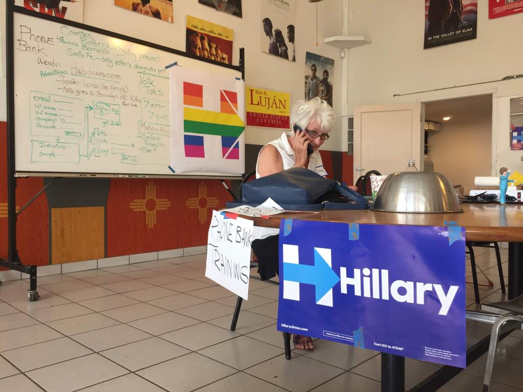 Retired historian Sandy Schackel, 74, of Santa Fe, New Mexico, makes phone calls in support of Democratic presidential candidate, Hillary Clinton, at local campaign headquarters in Santa Fe, N.M., on Monday June 6, 2016. Clinton secured enough delegate commitments Monday to become the presumptive Democratic nominee for president, hours before New Mexico voters go to the primary polls. (AP Photo/Morgan Lee)