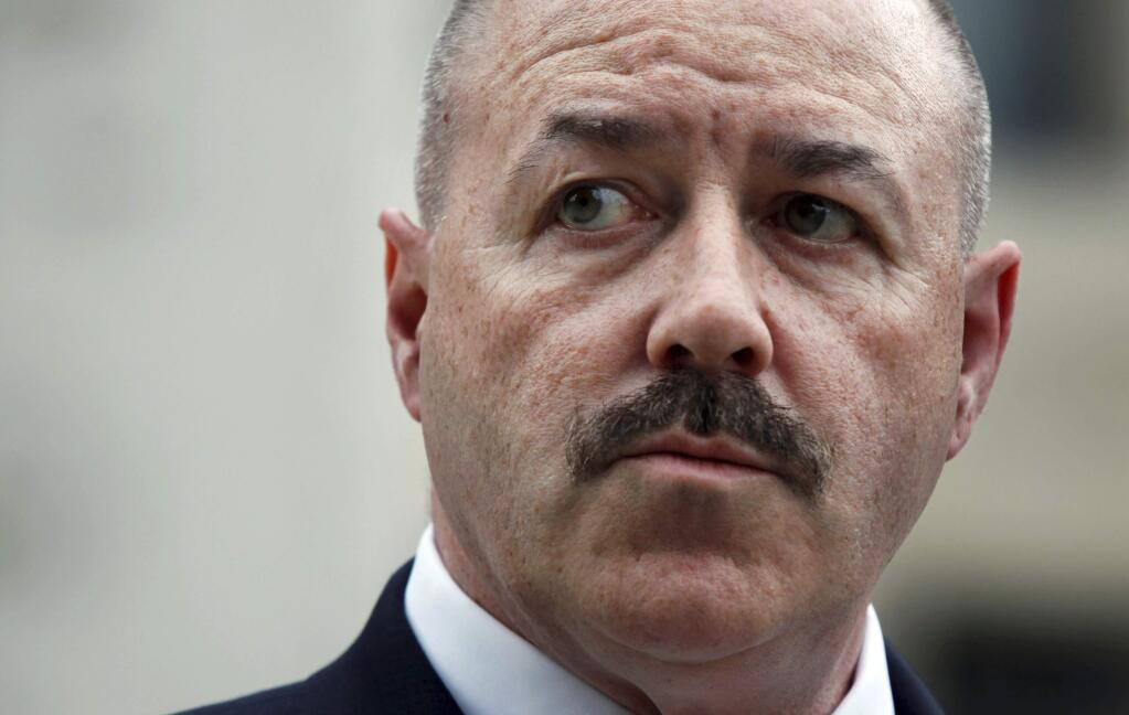 FILE - In this June 4, 2009 file photo, former New York City police Commissioner Bernie Kerik stands outside the Federal Court in Washington. President Donald Trump Trump granted clemency to Kerik. (AP Photo/Manuel Balce Ceneta, File)