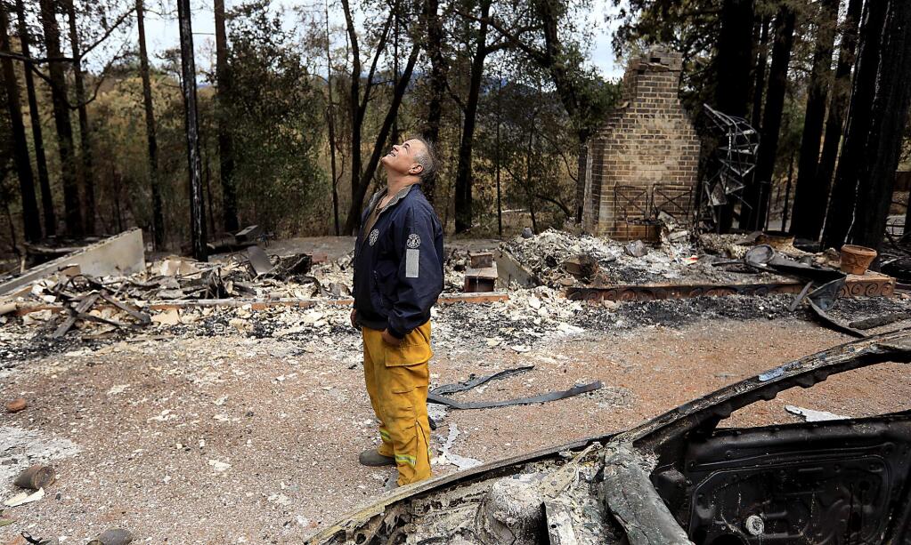 Bud Pochini, a volunteer with Knights Valley, lost his home to the Tubbs fire as he was saving homes elsewhere in the area, Thursday Oct. 19, 2017 near Calistoga. (Kent Porter / The Press Democrat) 2017