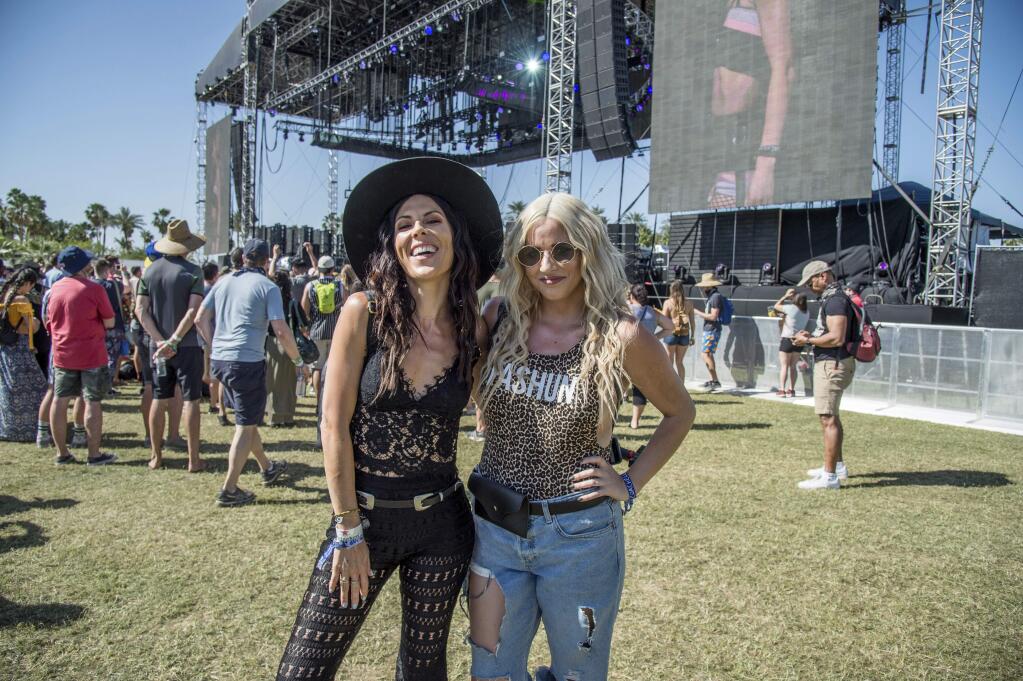 Joslyn Davis, left, and Lilly Marston, of Los Angeles, attend the Coachella Music & Arts Festival at the Empire Polo Club on Saturday, April 14, 2018, in Indio, Calif. (Photo by Amy Harris/Invision/AP)