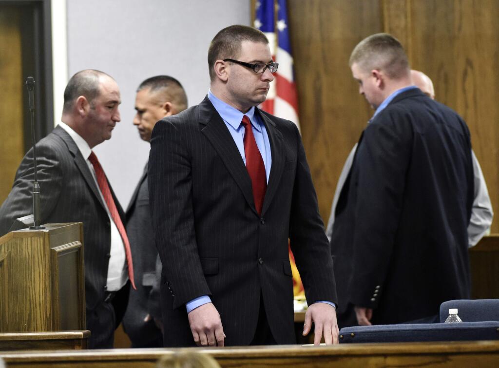 Former Marine Cpl. Eddie Ray Routh stands during his capital murder trial at the Erath County, Donald R. Jones Justice Center in Stephenville Texas, on Tuesday, Feb. 24, 2015. Routh, 27, of Lancaster, is charged with the 2013 deaths of Chris Kyle and his friend Chad Littlefield at a shooting range near Glen Rose, Texas. (AP Photo/The Dallas Morning News, Michael Ainsworth, Pool)