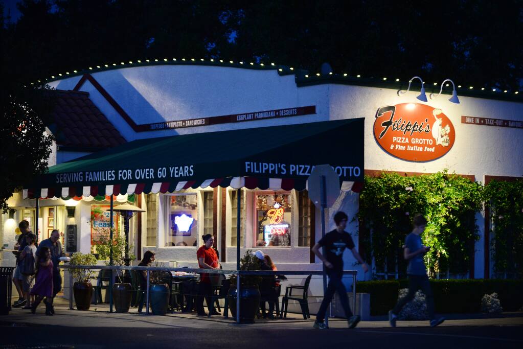 Filippi's Pizza Grotto located across the street from the Oxbow Public Market was one of the few restaurants opened for dinner service in downtown Napa. August 24, 2014. (Photo: Erik Castro/for The Press Democrat)