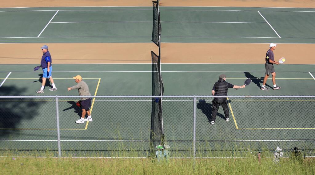 Residents use the east recreation area tennis courts to play pickleball in Oakmont in 2015. (KENT PORTER/ PD FILE)