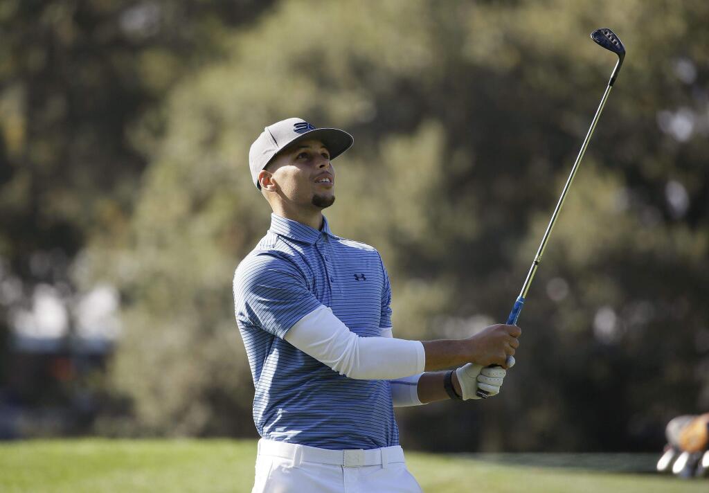 Golden State Warriors' Stephen Curry follows his shot from the 14th fairway of the Silverado Resort North Course during the pro-am event of the Safeway Open PGA golf tournament Wednesday, Oct. 12, 2016, in Napa, Calif. (AP Photo/Eric Risberg)