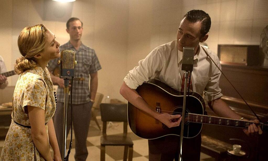 Tom Hiddleston struggles to portray the urgency in Hank William's life and music (here with Elizabeth Olson as his first wife Audrey).