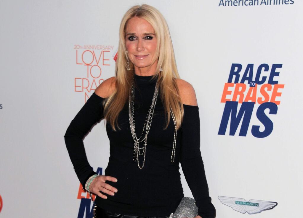 FILE - In this May 3, 2013 file photo, Kim Richards arrives at the 20th annual Race to Erase MS event in Los Angeles. Richards is out on bail after she was arrested on suspicion of shoplifting in Los Angeles. The 50-year-old reality TV star was jailed Sunday, Aug. 2, 2015, after being accused of taking about $600 in merchandise from a Target store in the Van Nuys area. (Photo by Jordan Strauss/Invision/AP, File)