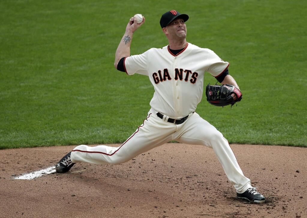 San Francisco Giants starting pitcher Tim Hudson throws against the St. Louis Cardinals during the first inning of Game 3 of the National League baseball championship series Tuesday, Oct. 14, 2014, in San Francisco. (AP Photo/Marcio Jose Sanchez)