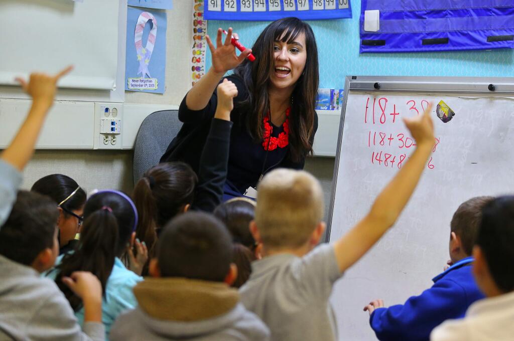 Third grade teacher Jenny Cavins asks her students to participate in solving a math equation at Flowery Elementary School, in Sonoma, on Tuesday, December 8, 2015. (Christopher Chung/ The Press Democrat)