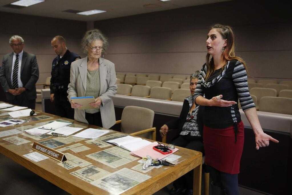 (From right) Merry Potter addresses the court while joined with her attorneys Victoria Yanez and Colleen O'Neal, Santa Rosa police officer Phillip Thompson, and Assistant City Attorney Rob Jackson during her trial for violating Santa Rosa city code at the Hall of Justice on Wednesday, May 16, 2018 in Santa Rosa, California . (BETH SCHLANKER/The Press Democrat)