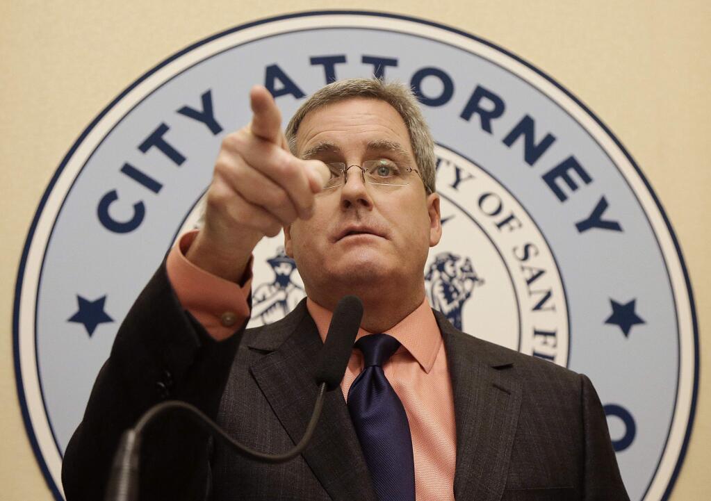 City Attorney Dennis Herrera gestures while speaking about a lawsuit filed against developers of the Millennium Tower at a news conference in San Francisco, Thursday, Nov. 3, 2016. San Francisco has sued the developer of the Millennium Tower, a sinking and tilting luxury high-rise, saying the developers knew about the problems but did not disclose the information to potential home buyers as required by law. (AP Photo/Jeff Chiu)