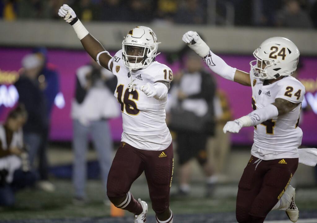 Arizona States' Aashari Crosswell, left, celebrates with Chase Lucas (24) after intercepting a pass intended for California's Jordan Duncan in the first half of an NCAA college football game, Friday, Sept. 27, 2019, in Berkeley, Calif. (AP Photo/Ben Margot)