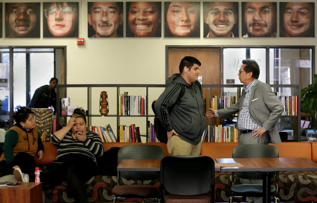 Santa Rosa Junior College president Dr. Frank Chong talks with student Jorge Romero at the Multicultural Innovation Center for Academic Success & Achievement on the SRJC campus in Santa Rosa on Tuesday, February 4, 2020. (BETH SCHLANKER/ The Press Democrat)