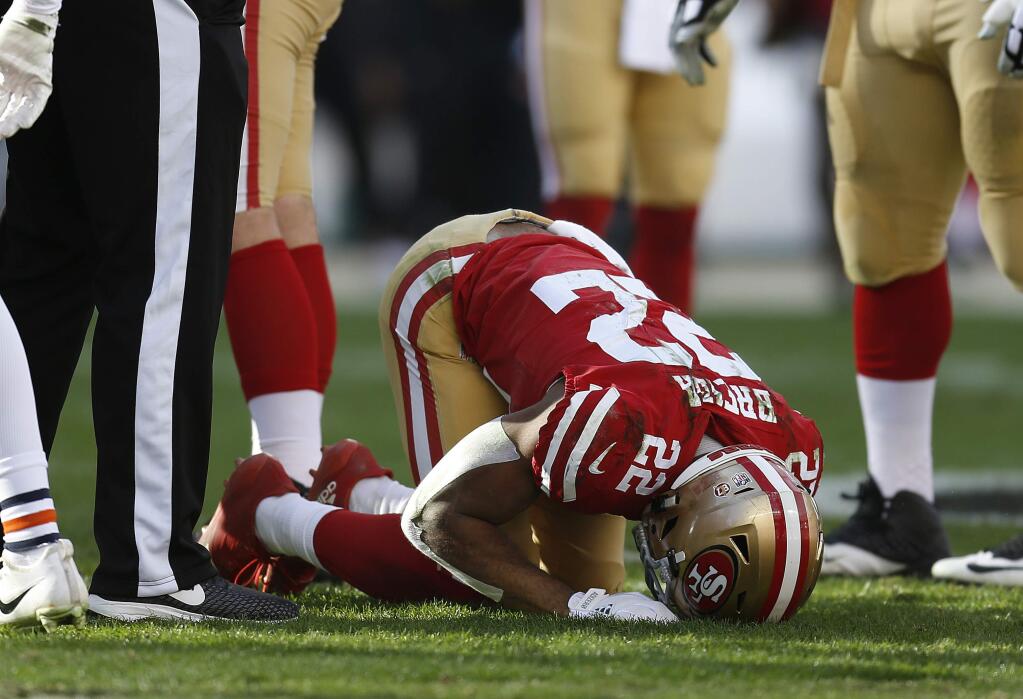 San Francisco 49ers running back Matt Breida (22) remains on the ground during the first half of an NFL football game against the Chicago Bears in Santa Clara, Calif., Sunday, Dec. 23, 2018. (AP Photo/D. Ross Cameron)