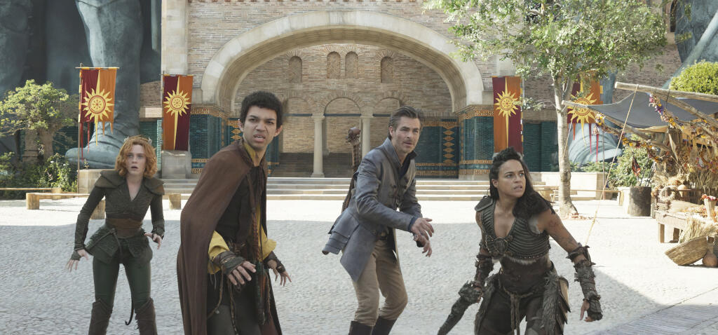 This image released by Paramount Pictures shows Sophia Lillis, Justice Smith, Chris Pine and Michelle Rodriguez in a scene from "Dungeons & Dragons: Honor Among Thieves." (Paramount Pictures via AP)