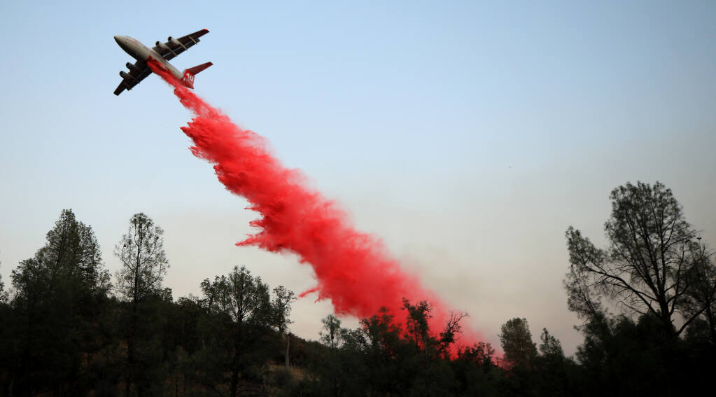 A BAe-146 is piloted in to position making a drop on the Sites fire in Colusa County, Sunday, Aug. 2, 2020. (Kent Porter / The Press Democrat) 2020