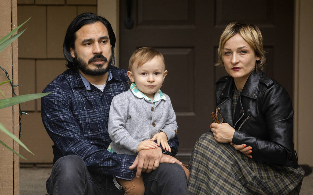 Ian Velasquez, his partner Amy Sprague and their son Neveo, 2, are nearly $17,000 behind in the rent on their Sebastopol home after roommates lost their jobs and had to move out at the beginning of the pandemic. More than 1 million California rental households face an estimate $3.7 billion rental debt. (John Burgess/The Press Democrat)