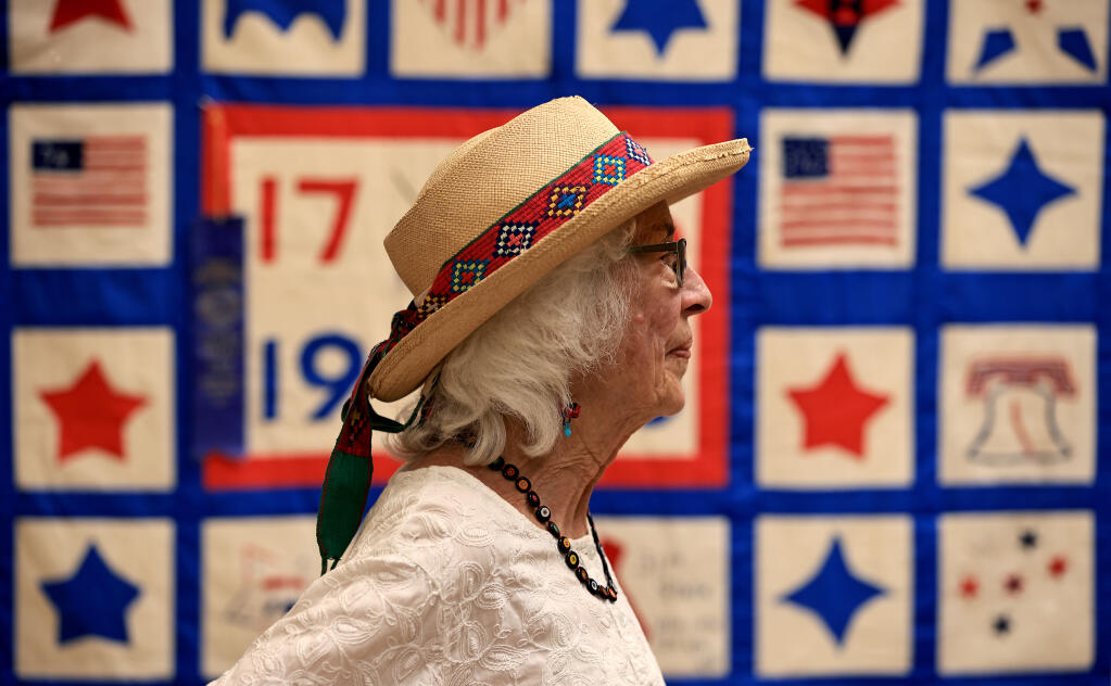 Joanne Filipello, a docent with the Depot Park Museum in Sonoma, Saturday, June 11, 2022. The Sonoma Valley Historical Society is displaying quilts at the museum, including Filipello's five generations of family quilts.  (Kent Porter / The Press Democrat) 2022