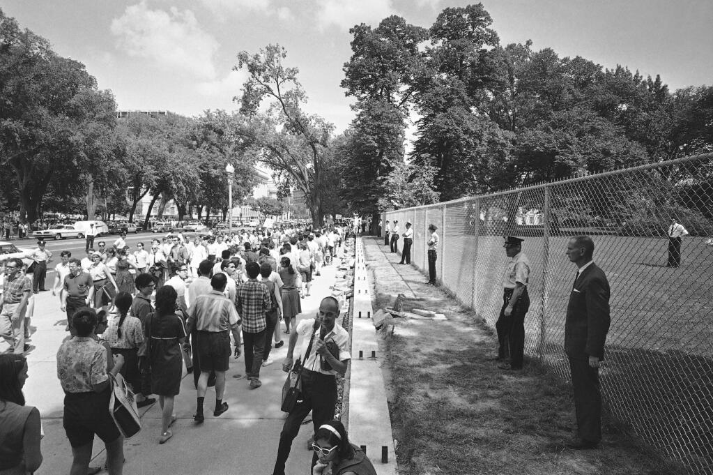 FILE - Students by the thousands, protesting U.S. participation in the fighting in Vietnam, move along the Mall toward the U.S. Capitol on April 17, 1965, after a rally at the Washington Monument. Todd Gitlin, a prominent anti-war and campus activist of the 1960s who drew upon his experiences and influenced many others as an author, sociologist and educator, has died at age 79. Gitlin was a onetime president of Students for a Democratic Society, one of the leading campus organizations of the ’60s and also helped organize one of the first major protests against the Vietnam War in Washington, in 1965. His sister Judy Gitlin confirmed his death Saturday, Feb. 5, 2022. (AP Photo/Charles Tasnadi, File)