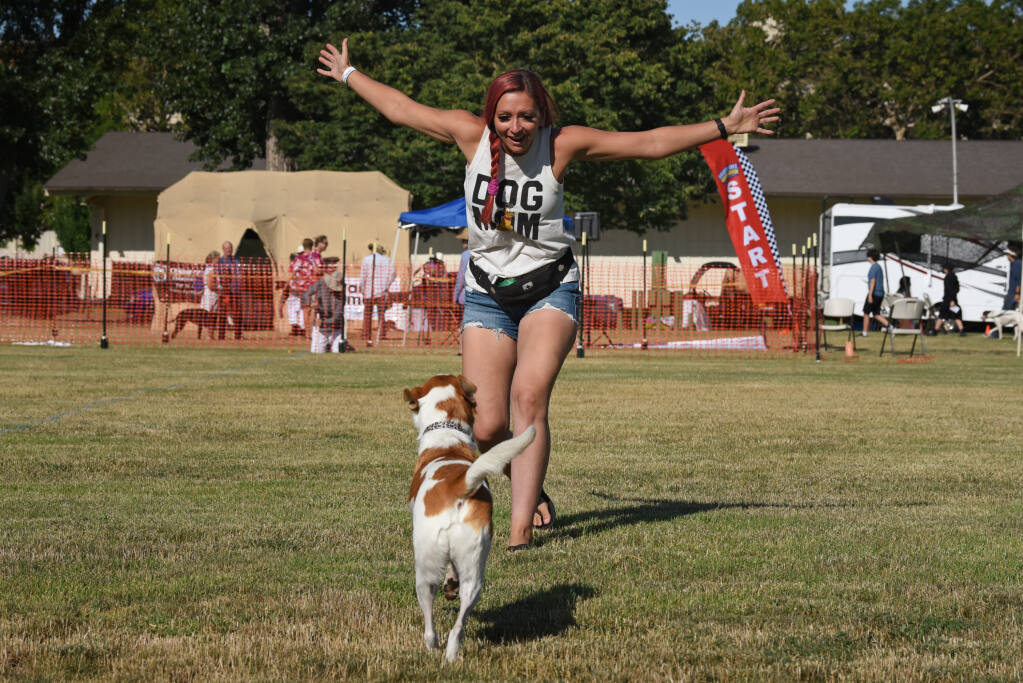 Tyree Hand getting her dog Marilyn excited about their day at the Wine Country Canine Fun Run held at the Sonoma County Fairgrounds in Santa Rosa, Calif. on Saturday, July 10, 2021. (Photo: Erik Castro/for The Press Democrat)