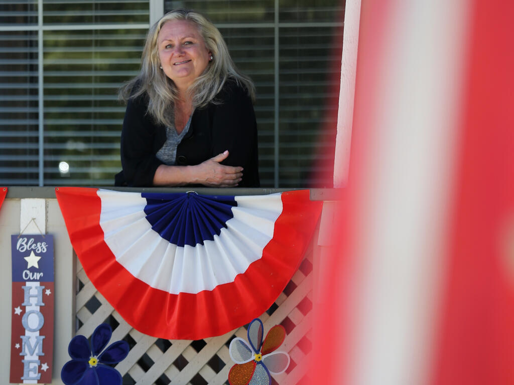 Annalise Manning outside her home in Petaluma done up for The Fourth of July (Beth Schlanker/The Press Democrat)